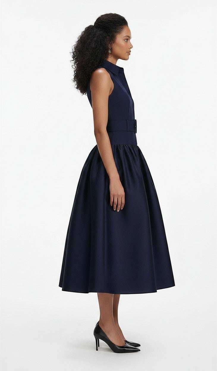 navy sleeveless midi dress in structured twill with a collared neckline and belted waist.