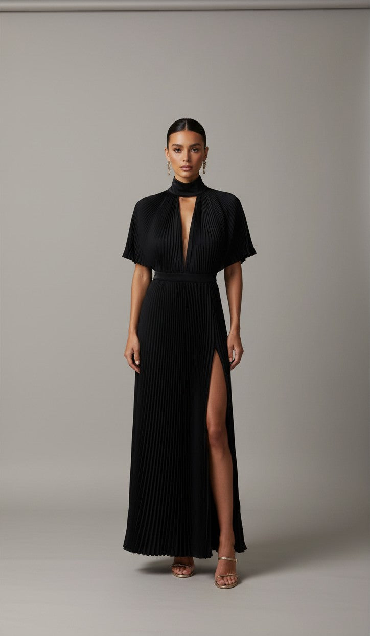 S T Y L E L I B R A R Y black pleated gown with high neck, flared sleeves, and thigh-high split for formal events.