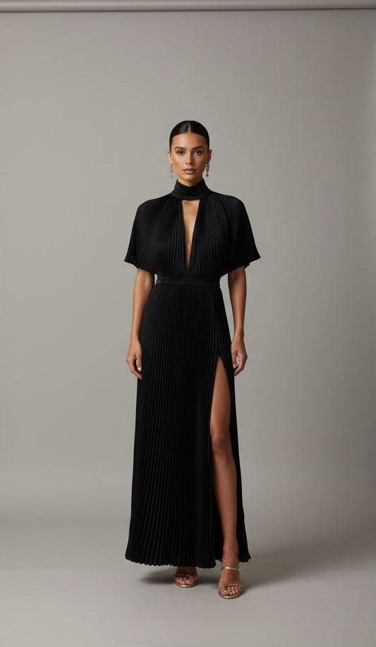 S T Y L E L I B R A R Y black pleated gown with high neck, flared sleeves, and thigh-high split for formal events.
