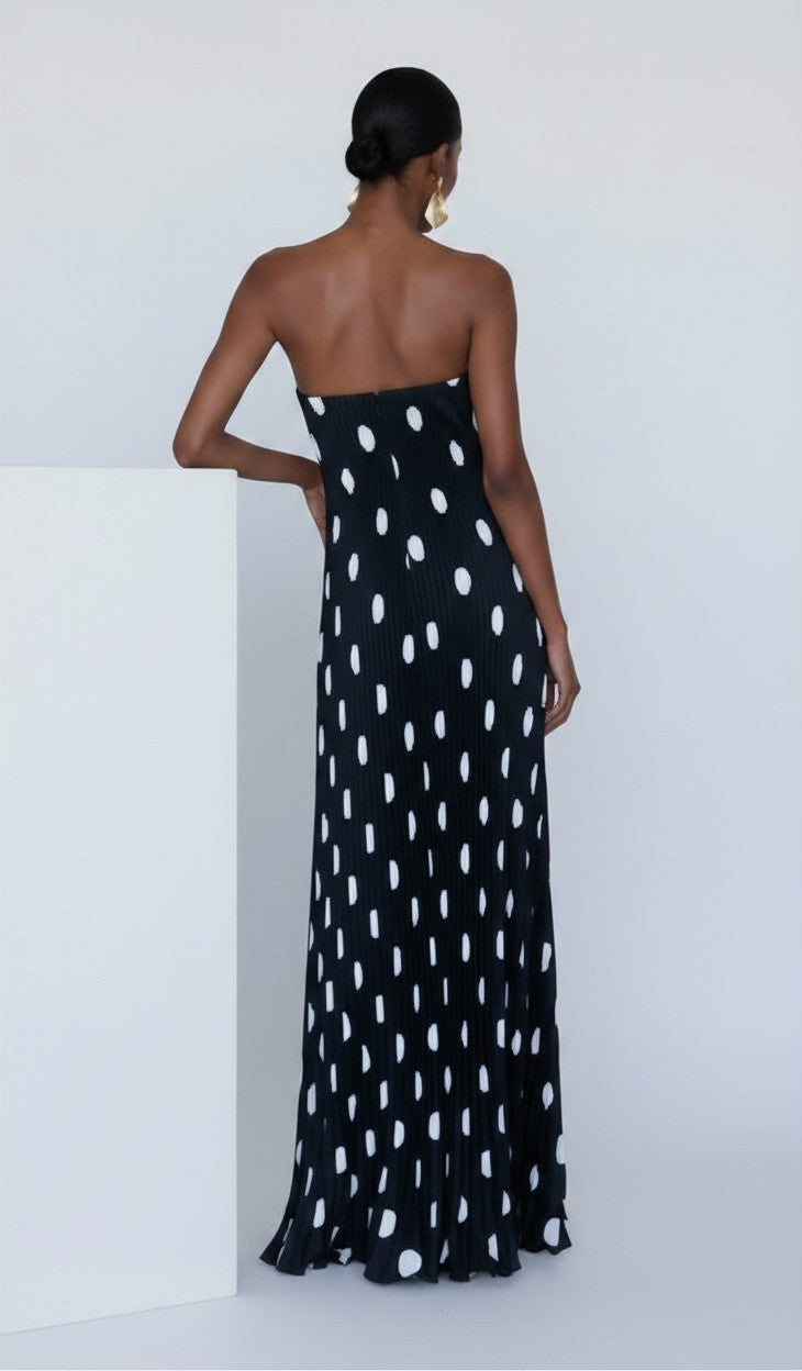 S T Y L E L I B R A R Y black strapless maxi dress with white polka dots and pleated fabric, back view