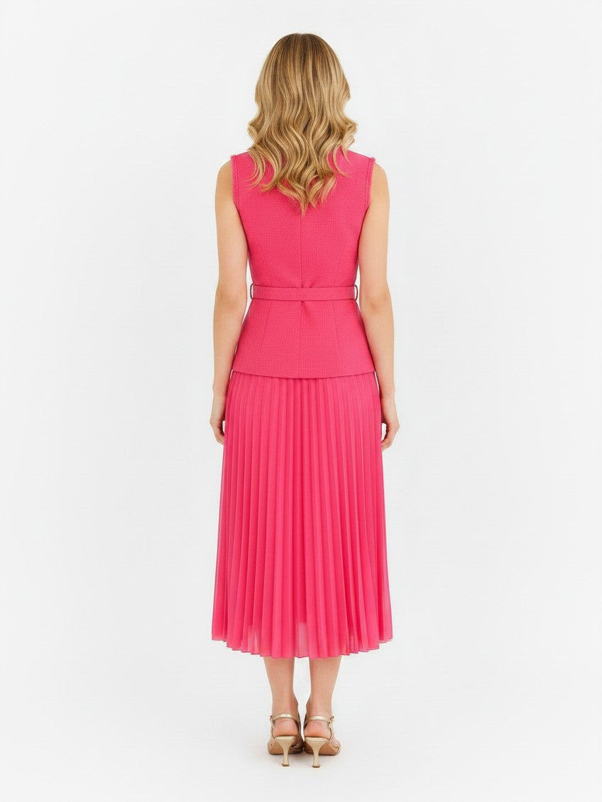 Back view of S T Y L E L I B R A R Y Rebecca Vallance pink boucle midi dress with pleated skirt and belted waist