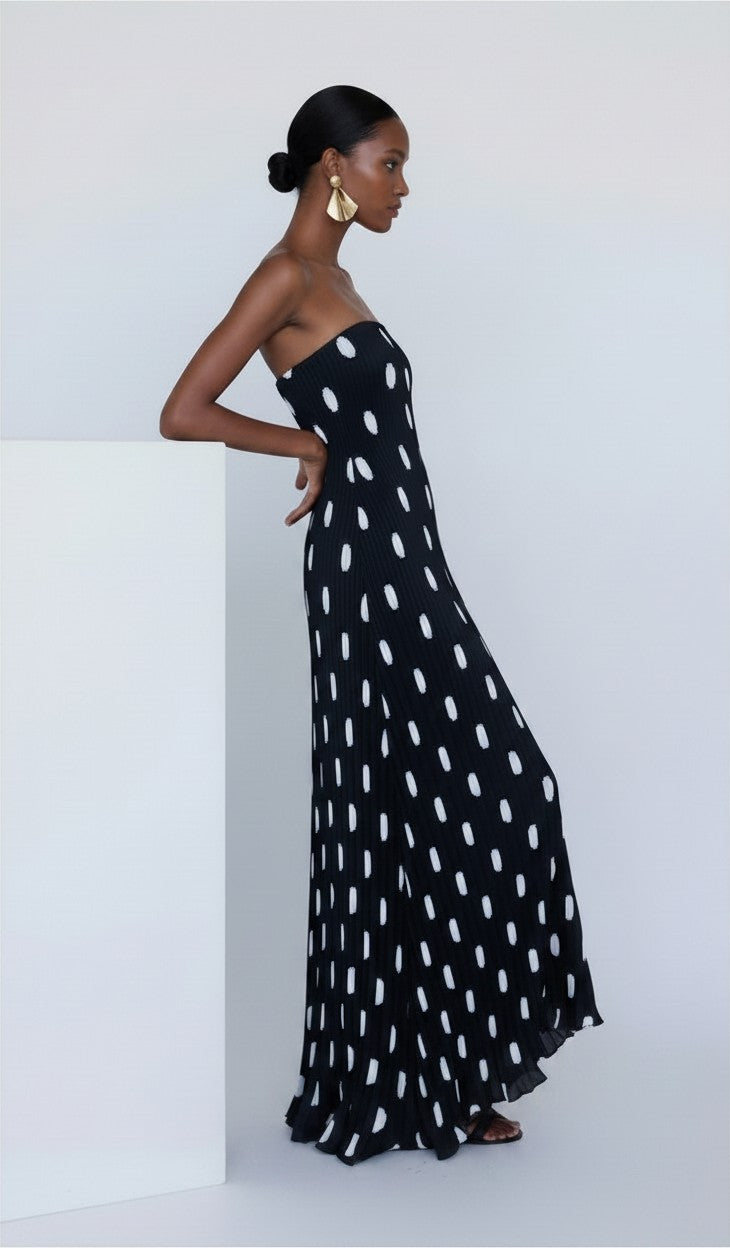 S T Y L E L I B R A R Y black and white polka dot strapless pleated maxi dress worn by a model in a studio setting.