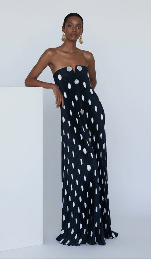 S T Y L E L I B R A R Y black and white polka dot strapless pleated maxi dress worn by a model in a studio setting.